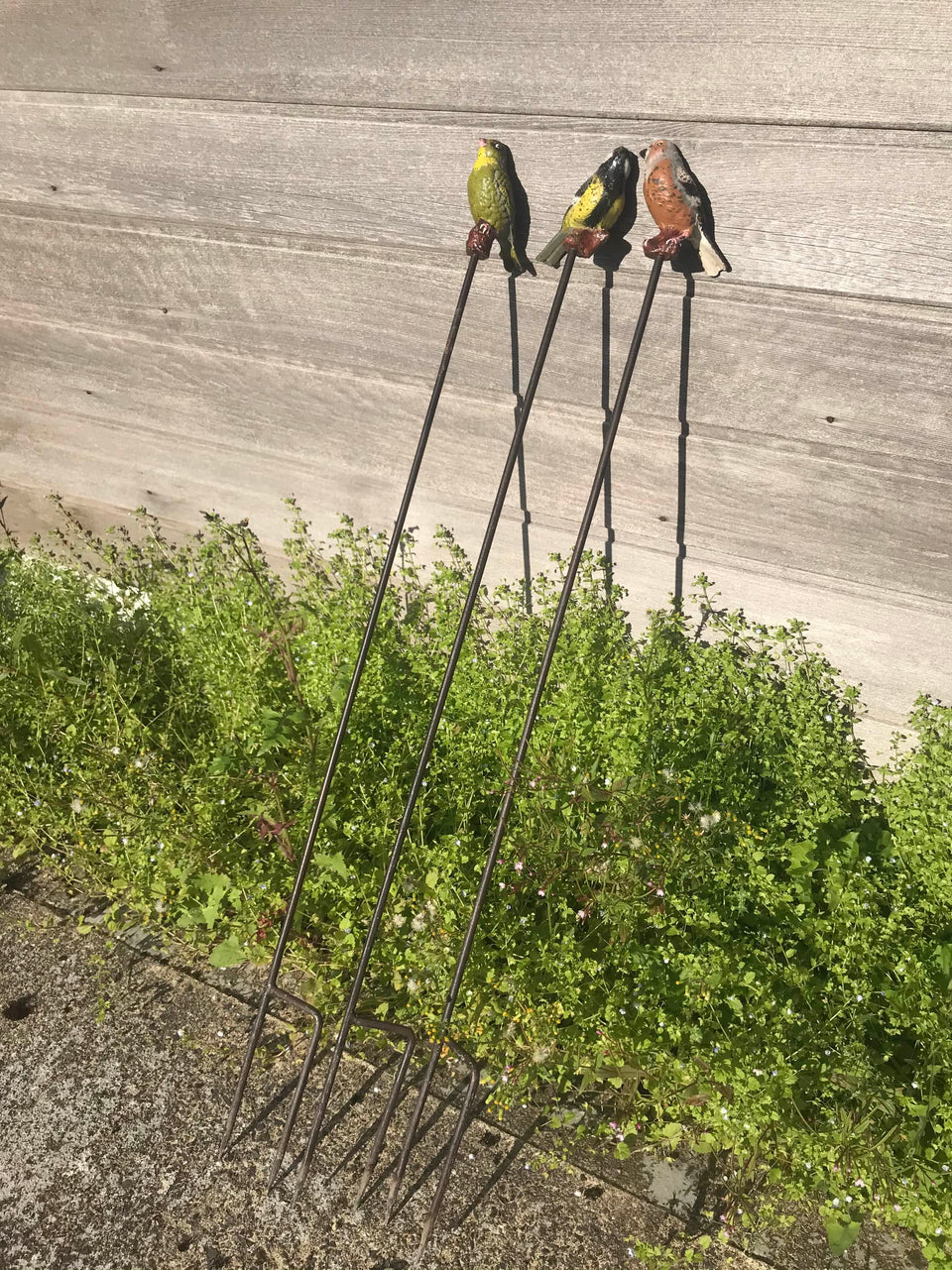 Three Cast-Iron-Birds on Iron Spikes