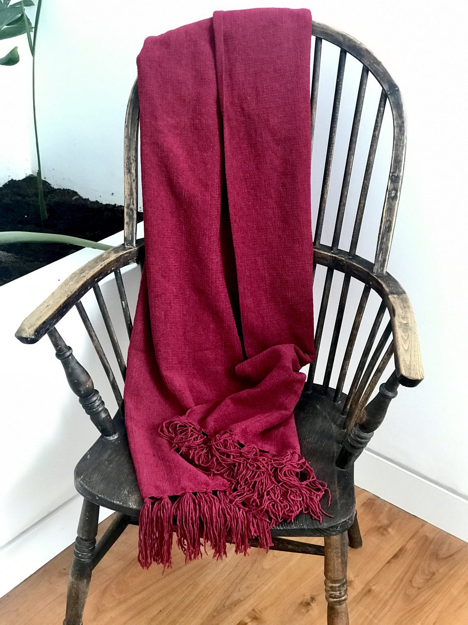 soft red throw with tassels