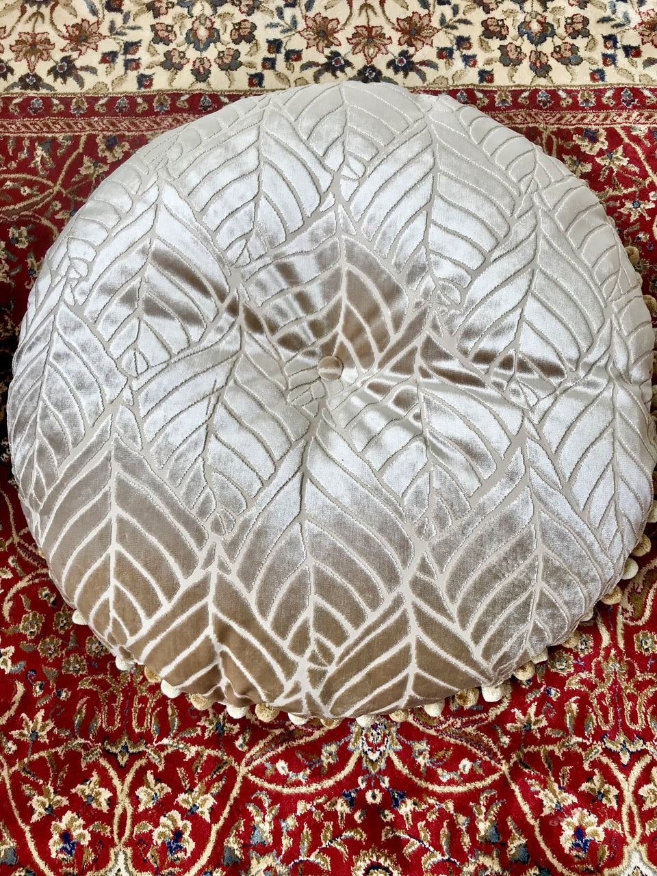 round buttoned damask cushion