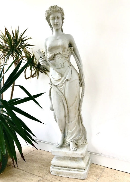 large statue of a female with bow and arrow