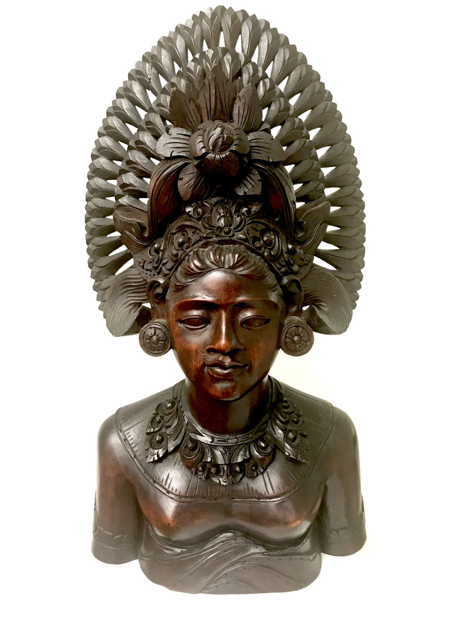 Balinese wood carving of a woman in headdress