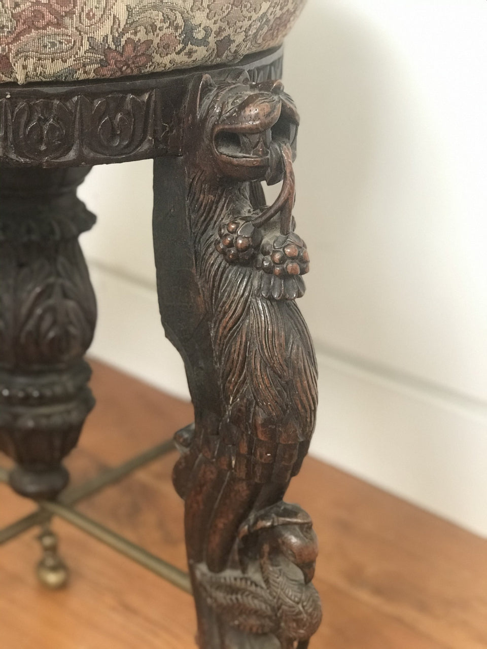 upholstered stool with carved hardwood legs with lions and birds