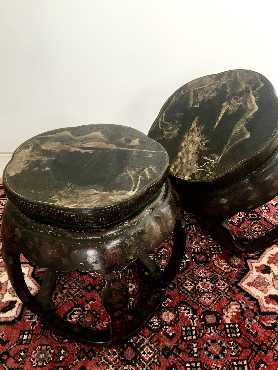 A pair of antique Chinese lacquered stools